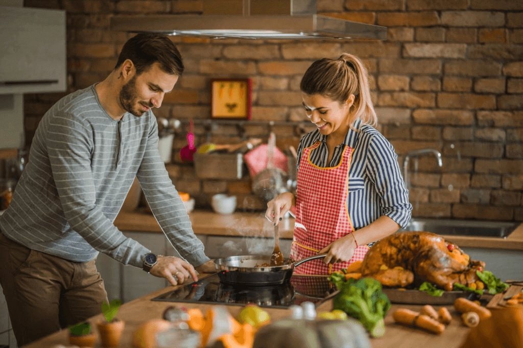 Couple Making Food Stay Home Date Ideas